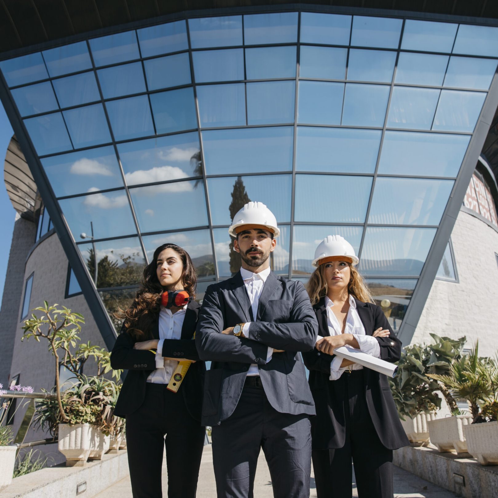 three-architects-front-building-with-big-windows